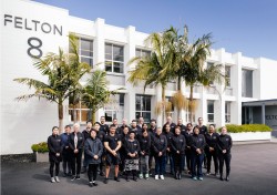 Felton team stands outside the Felton factory